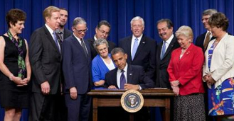 photo of Obama signing EXIM bill